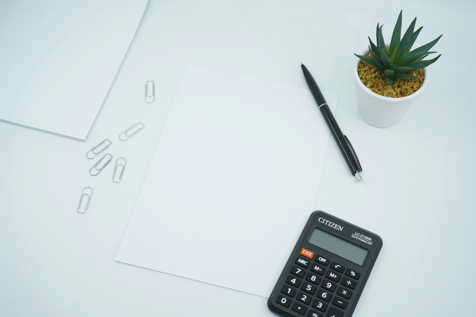 A calculator and blank invoice paperwork ready for filling in GST details