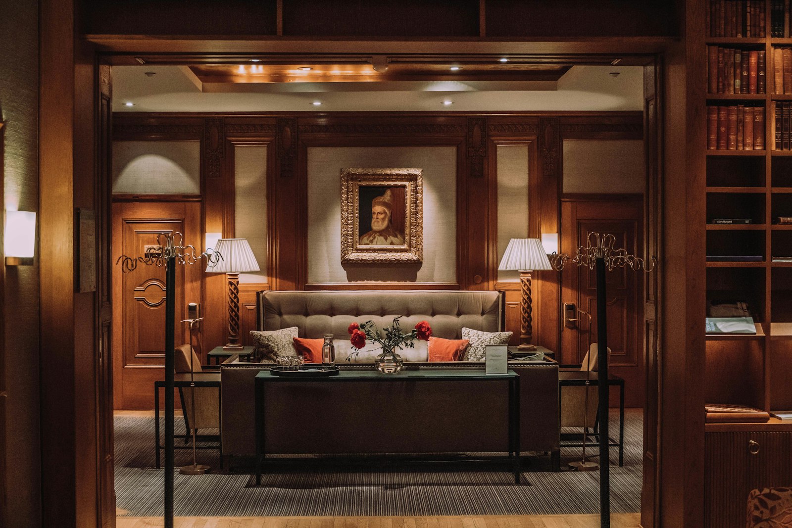 A warm, wood-panelled luxury hotel suite